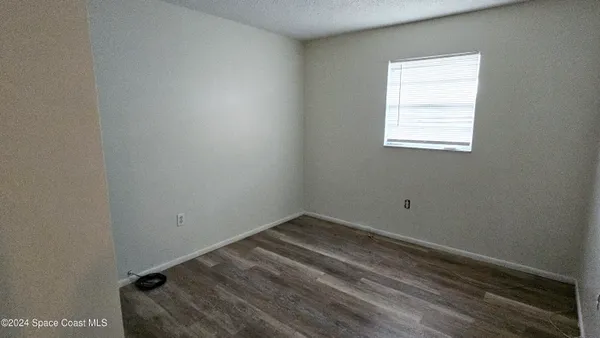 a view of a room that has a bench in it