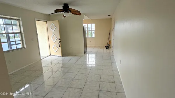 a kitchen with stainless steel appliances a sink a counter and cabinets