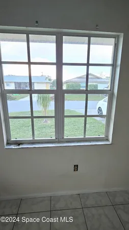 a view of an empty room and window