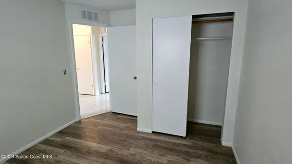 a bathroom with a shower toilet and sink