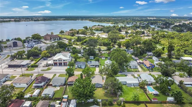 an aerial view of residential building and lake