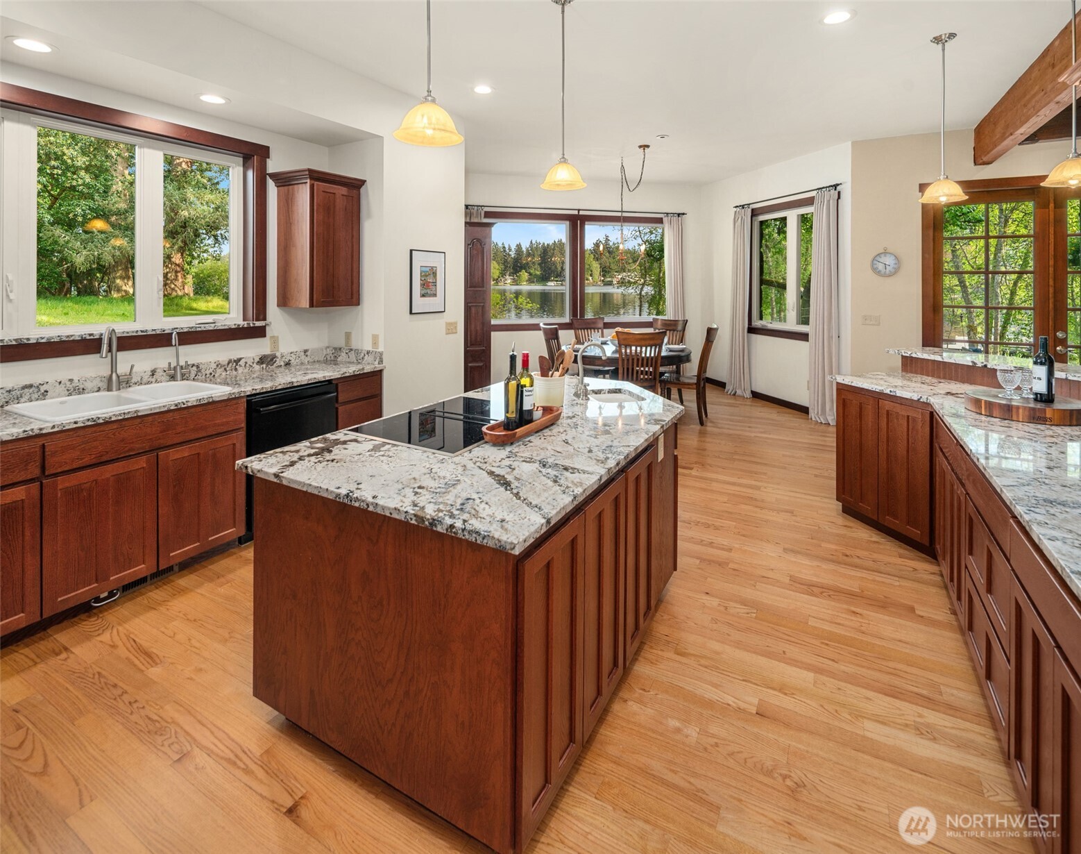 1000 Creso Road South Spanaway, WA 98387 - Photo 10 of 40 a large kitchen with granite countertop lots of counter space and sink