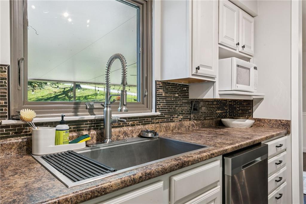 1508 Cemetery Street Monessen, PA 15062 - Photo 11 of 41 a kitchen with a sink and a stove top oven