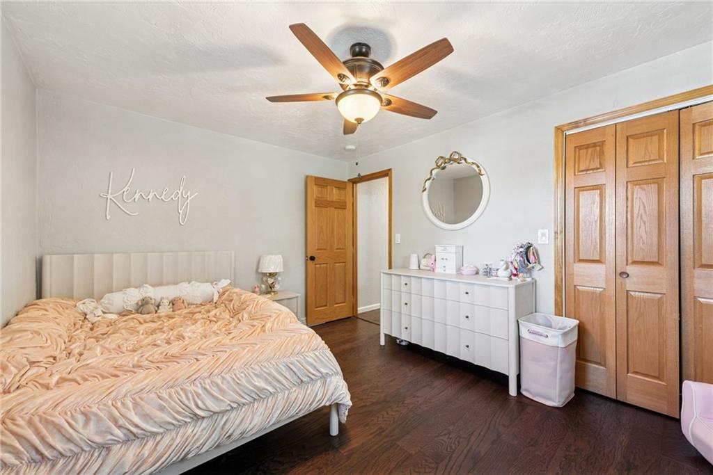 1508 Cemetery Street Monessen, PA 15062 - Photo 18 of 41 a bedroom with a bed and a chandelier