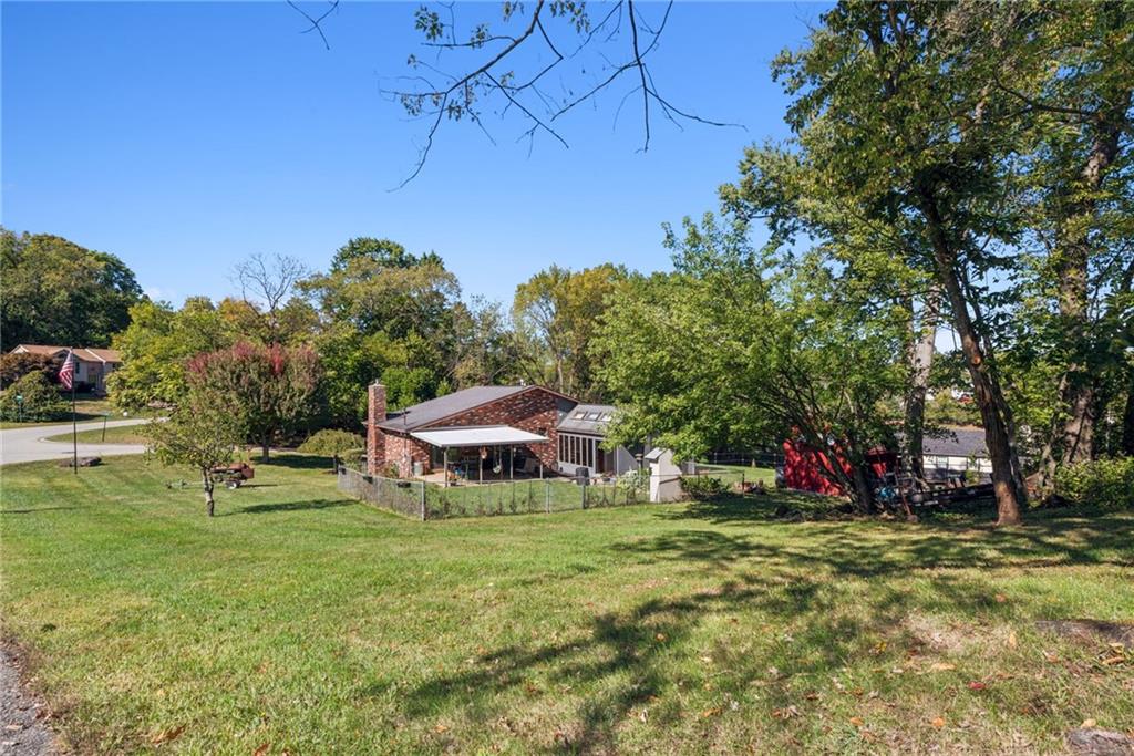 1508 Cemetery Street Monessen, PA 15062 - Photo 32 of 41 a view of backyard with table and chairs and potted plants