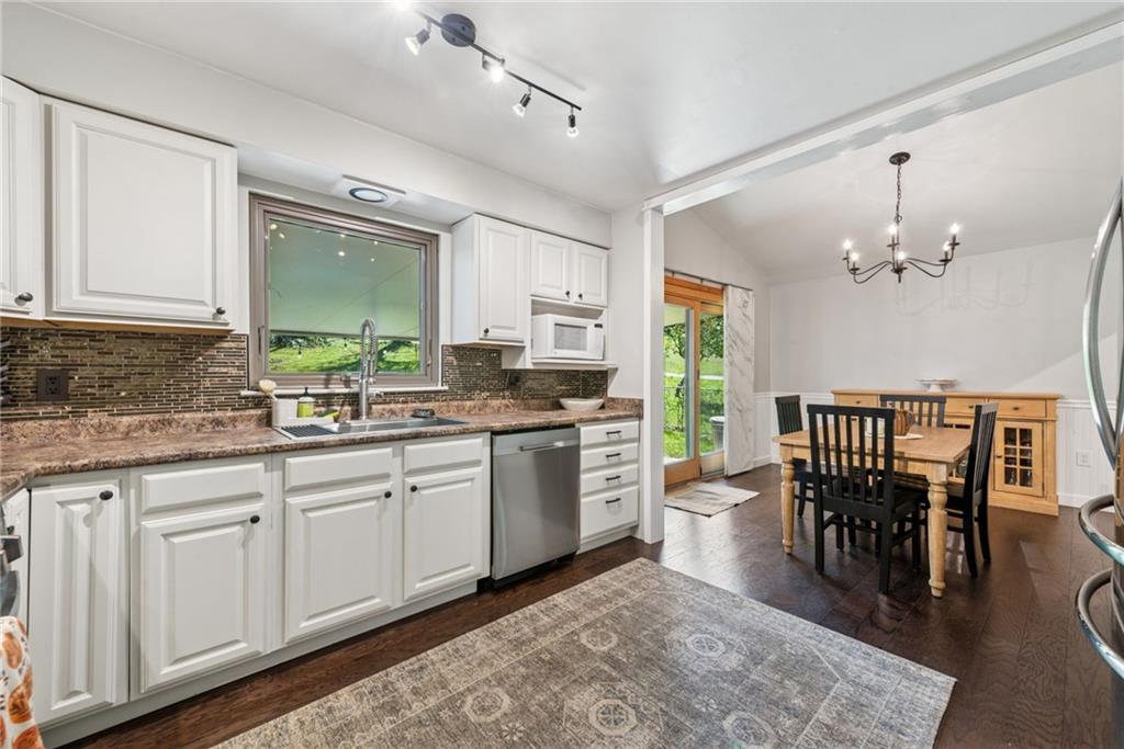 1508 Cemetery Street Monessen, PA 15062 - Photo 5 of 41 a kitchen with a white cabinets stove and sink