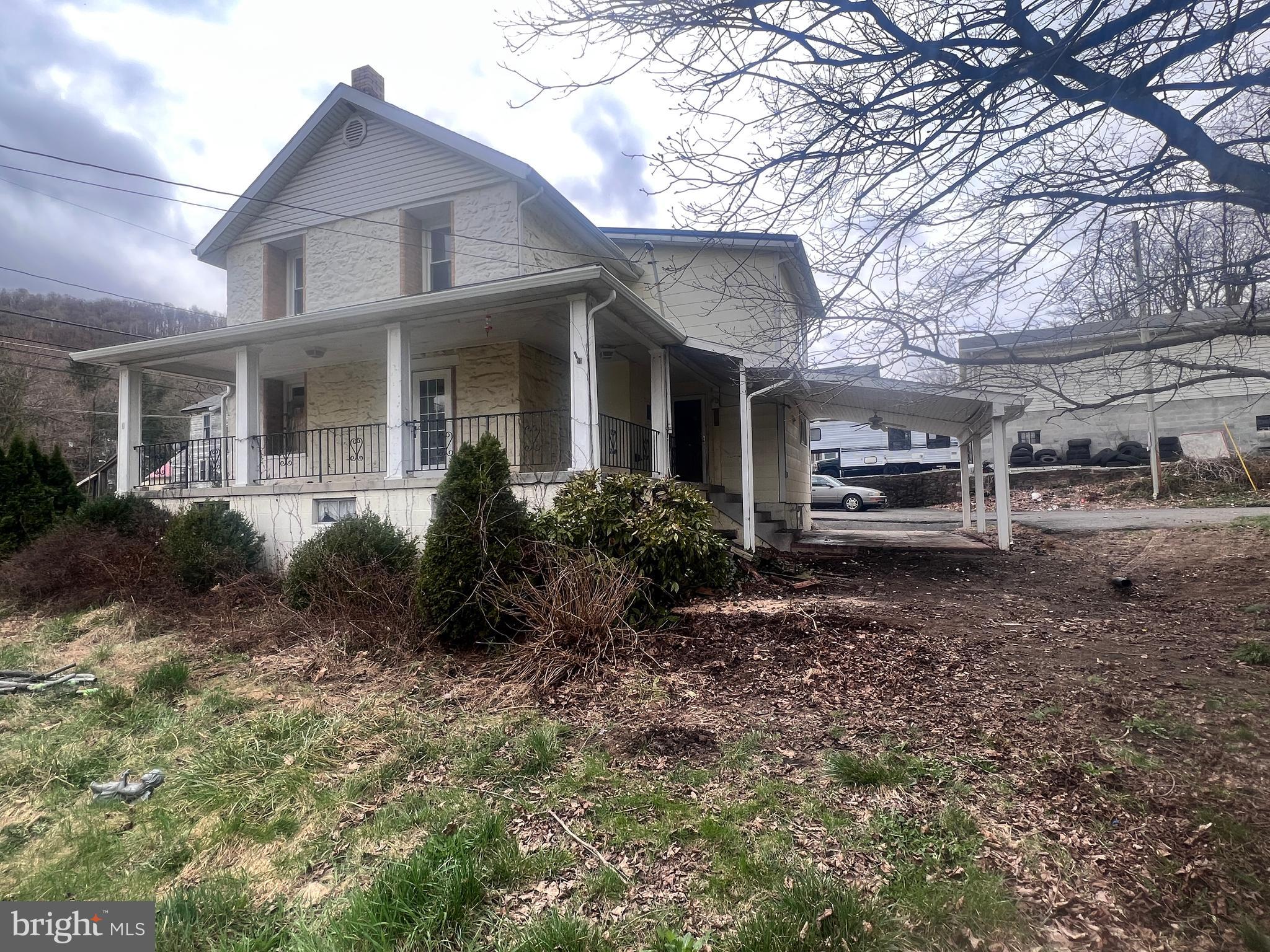 15515 Mt Savage Road Northwest Mount Savage, MD 21545 - Photo 33 of 39 a view of a house with backyard and trees