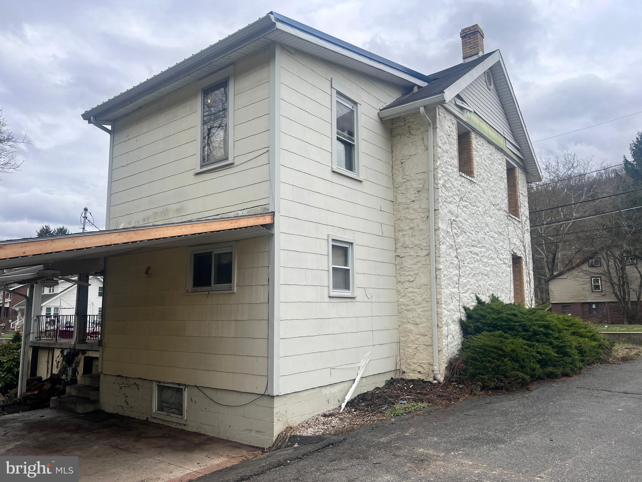 15515 Mt Savage Road Northwest Mount Savage, MD 21545 - Photo 34 of 39 a view of house that has a window and wooden fence