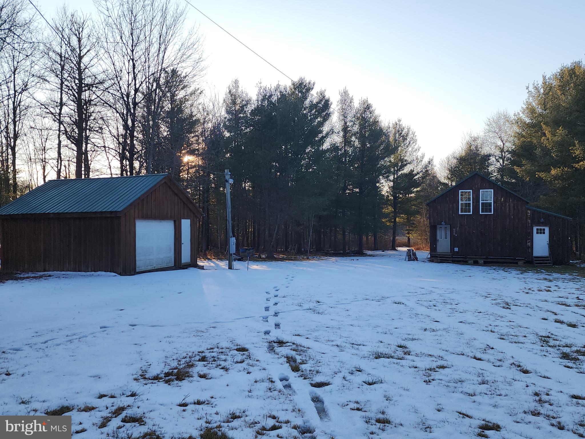 549 Blake Road Blossburg, PA 16912 - Photo 23 of 26 a house with trees in front of it