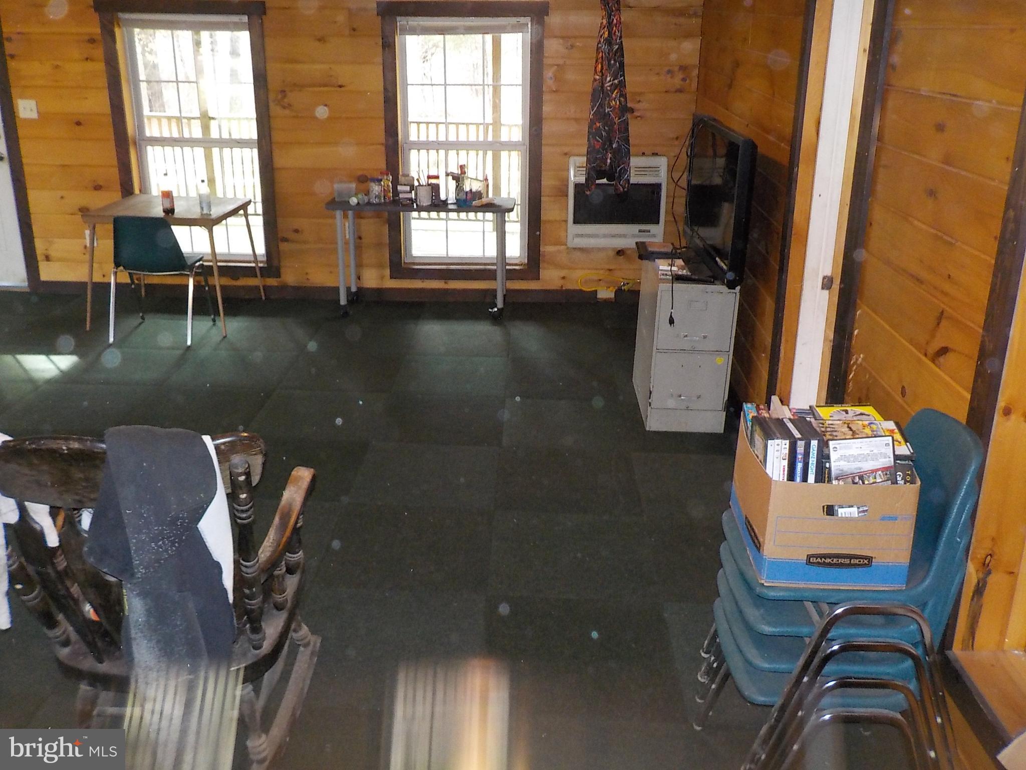549 Blake Road Blossburg, PA 16912 - Photo 4 of 26 a view of a workspace with furniture and a window