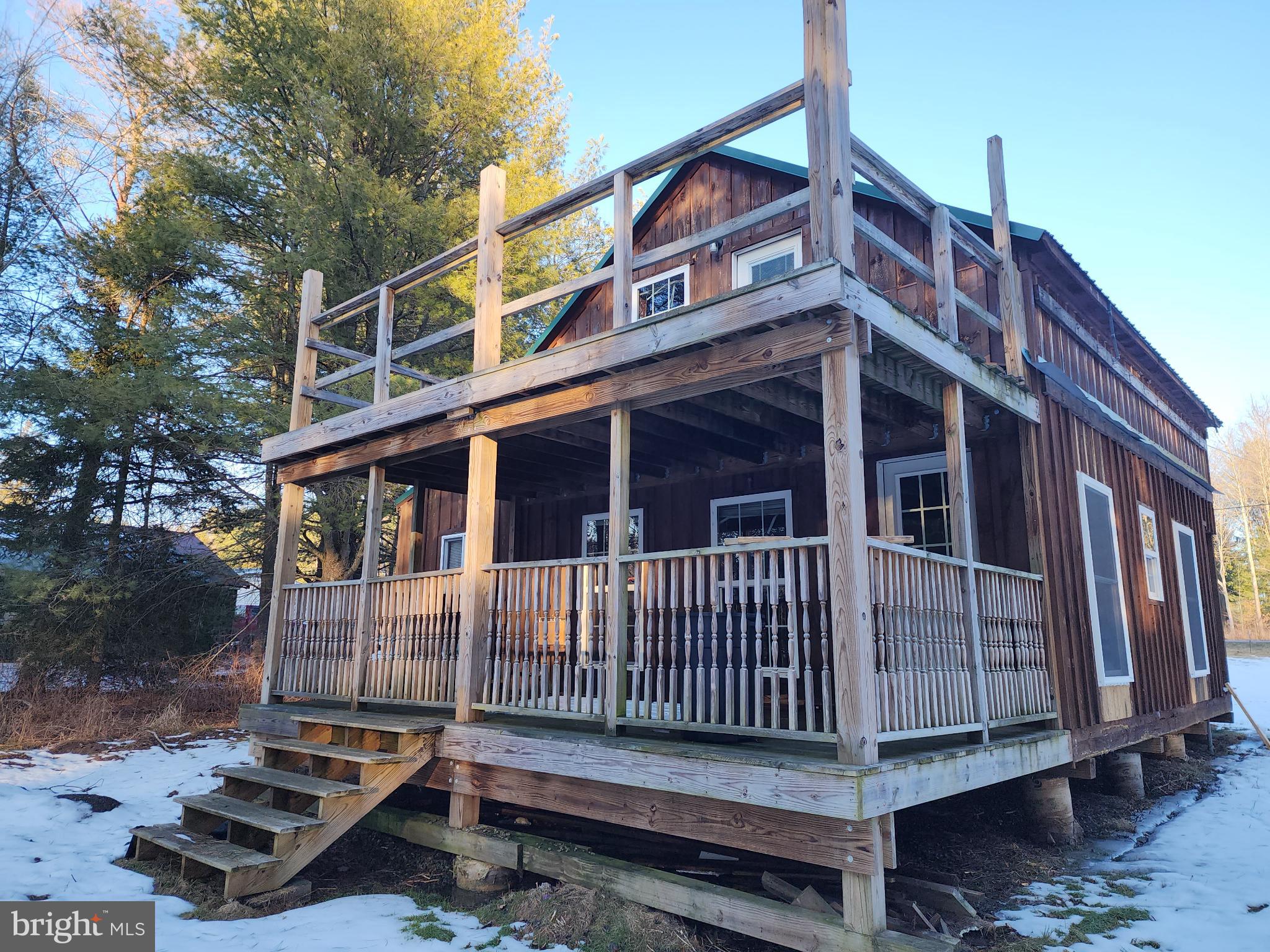 549 Blake Road Blossburg, PA 16912 - Photo 10 of 21 a view of a house with wooden deck front of house