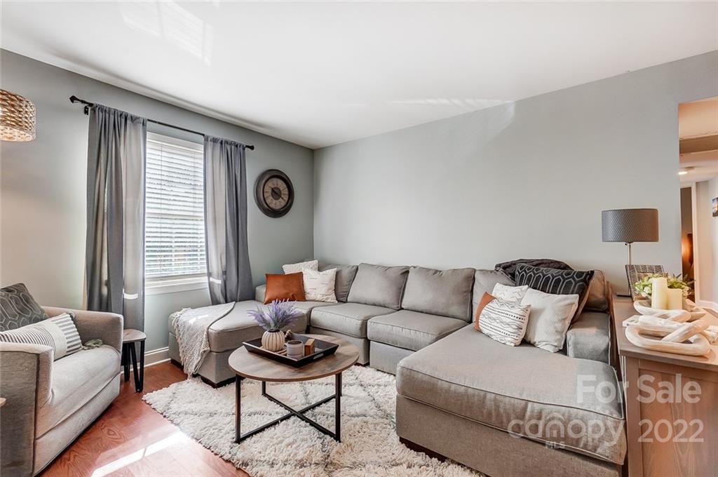 4919 Park Road, Unit C Charlotte, NC 28209 - Photo 19 of 41 a living room with furniture and a large window