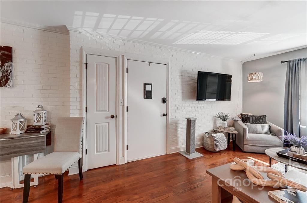 4919 Park Road, Unit C Charlotte, NC 28209 - Photo 20 of 41 a living room with furniture and a flat screen tv