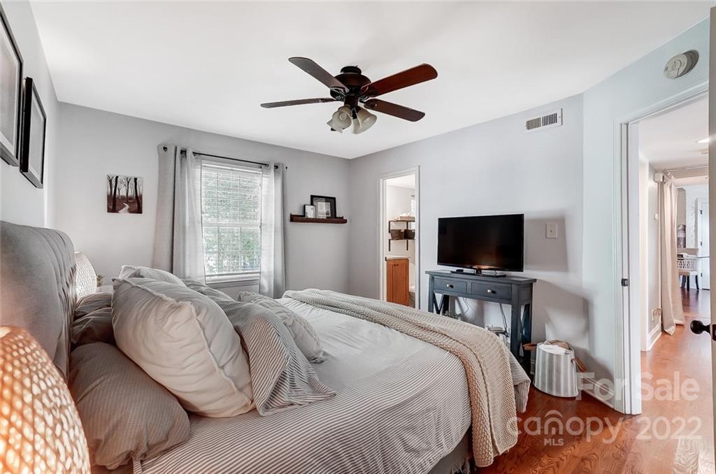 4919 Park Road, Unit C Charlotte, NC 28209 - Photo 23 of 41 a bedroom with a bed and a flat screen tv