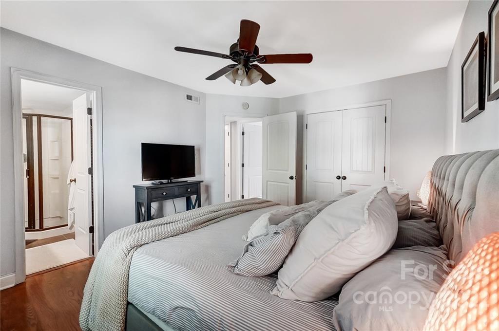 4919 Park Road, Unit C Charlotte, NC 28209 - Photo 25 of 41 a bedroom with a bed and a flat screen tv