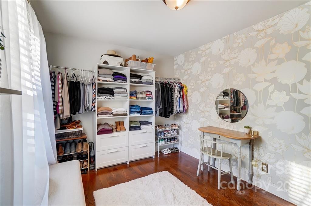 4919 Park Road, Unit C Charlotte, NC 28209 - Photo 28 of 41 a view of walk in closet with clothes and shoes