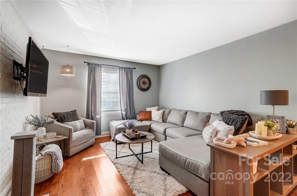 4919 Park Road, Unit C Charlotte, NC 28209 - Photo 6 of 41 a living room with furniture and a flat screen tv