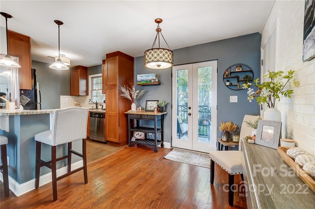 4919 Park Road, Unit C Charlotte, NC 28209 - Photo 7 of 41 a view of a dining room with furniture wooden floor and chandelier