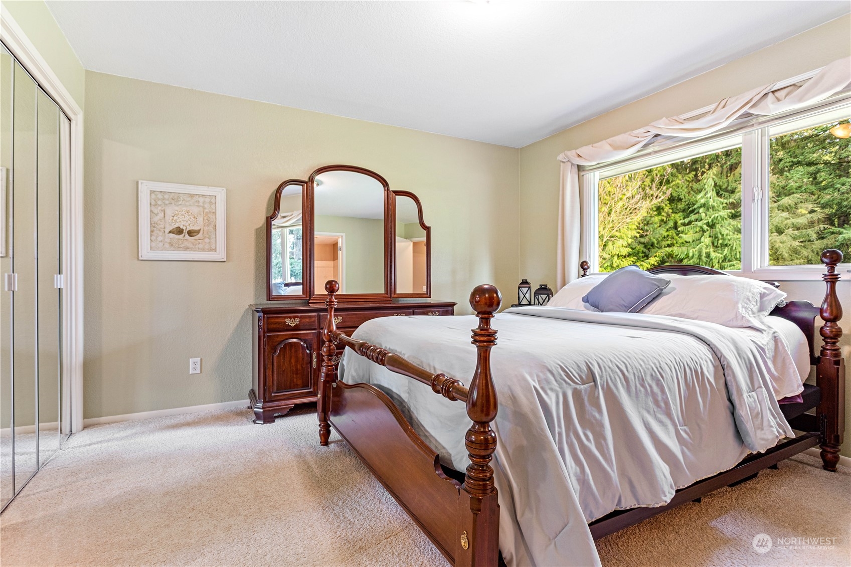 8669 Berthusen Road Lynden, WA 98264 - Photo 14 of 39 a bed sitting in a bedroom next to a window