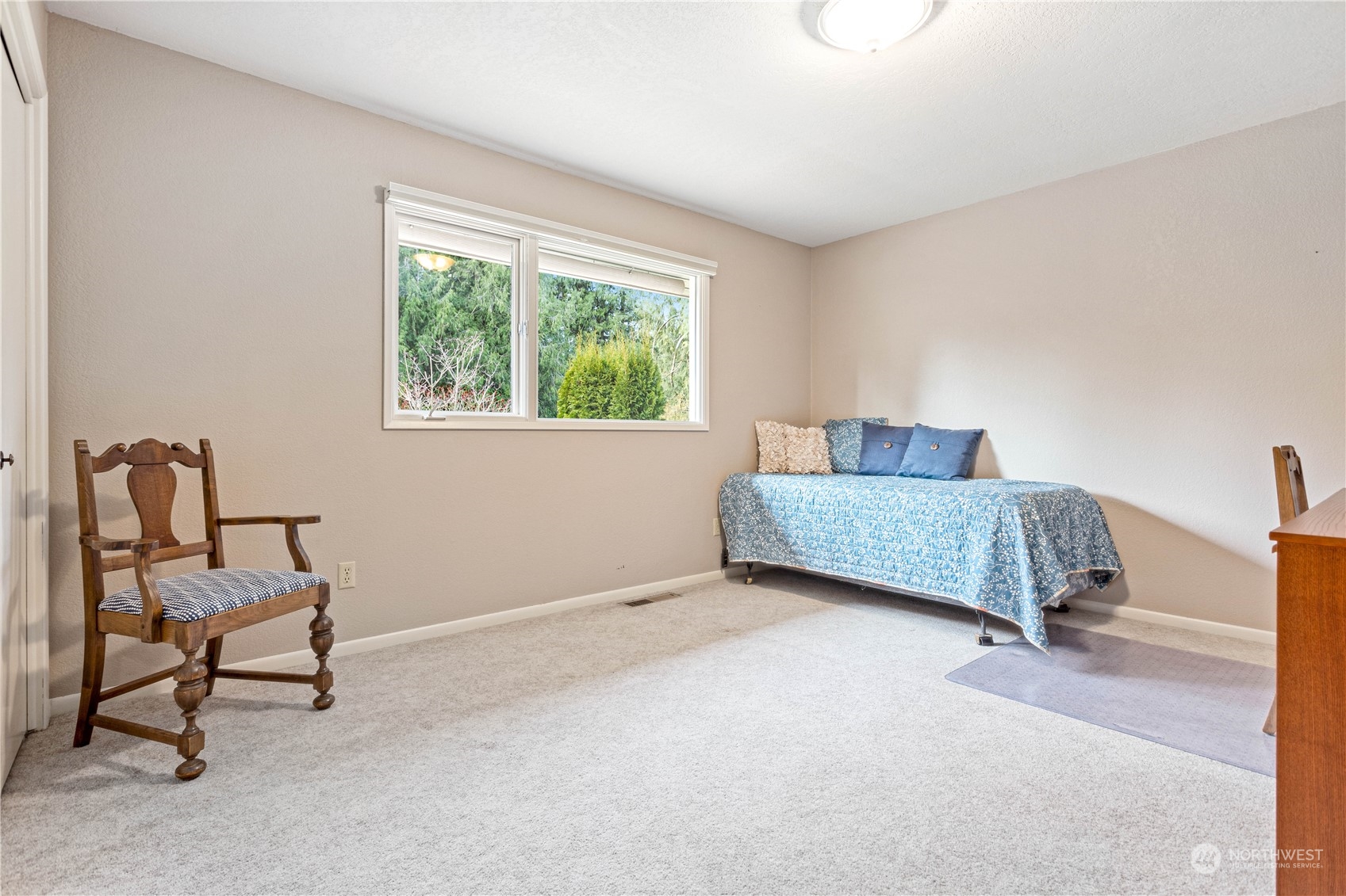8669 Berthusen Road Lynden, WA 98264 - Photo 16 of 39 a living room with a couch and a window