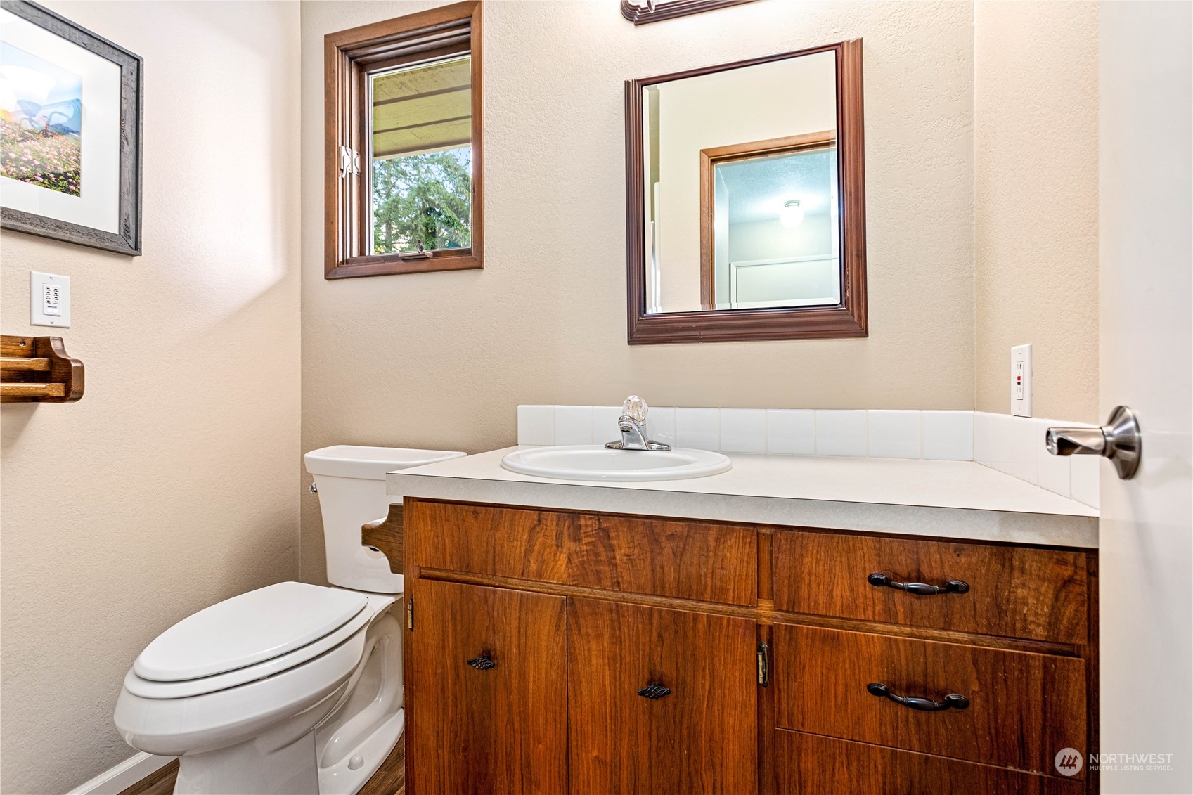 8669 Berthusen Road Lynden, WA 98264 - Photo 18 of 39 a bathroom with a sink vanity mirror and toilet
