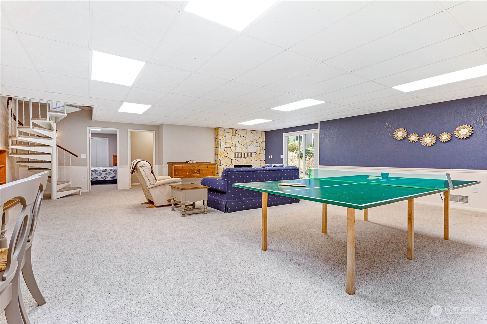 8669 Berthusen Road Lynden, WA 98264 - Photo 19 of 39 a living room with furniture a window and gym equipment
