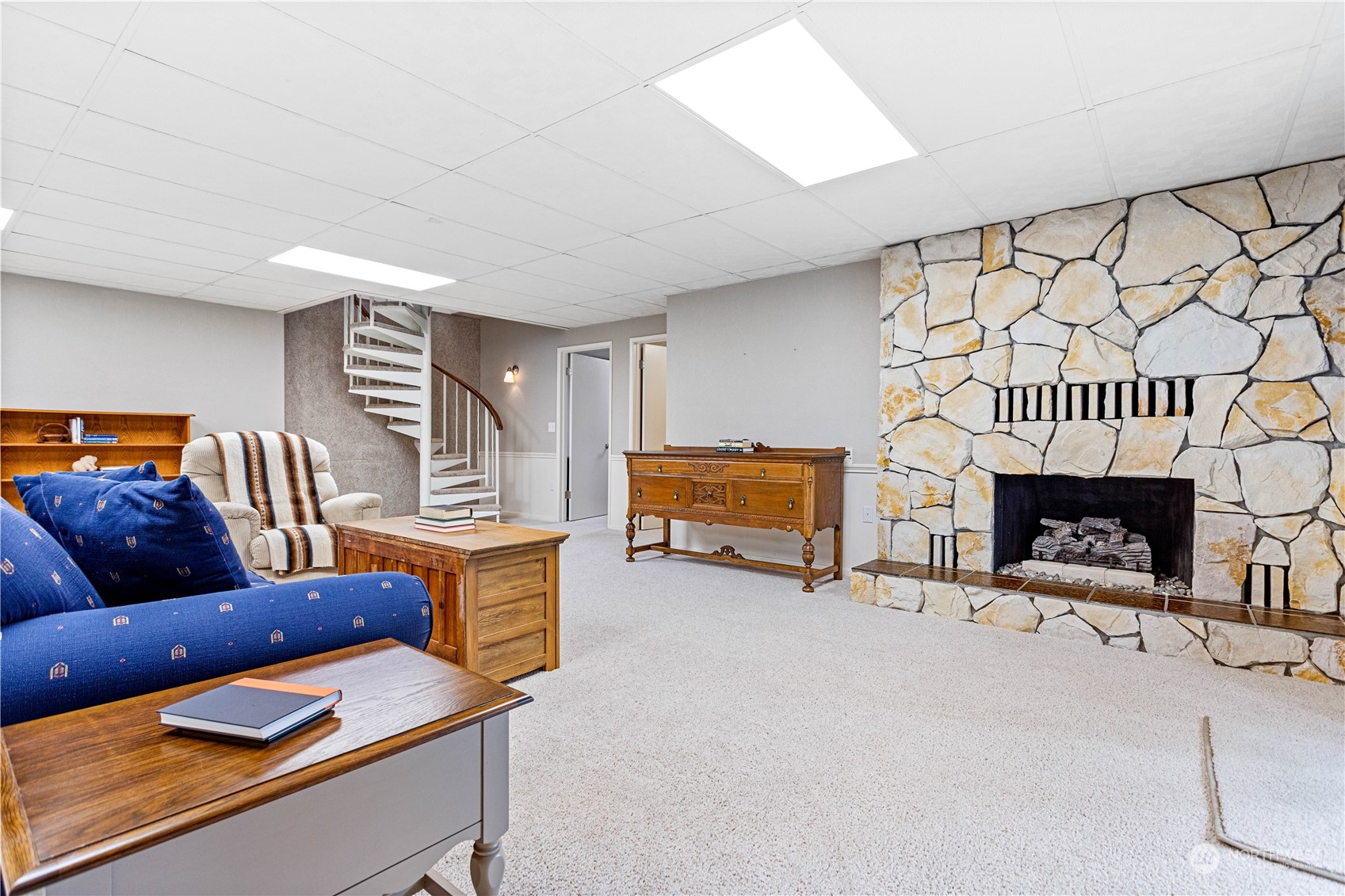 8669 Berthusen Road Lynden, WA 98264 - Photo 20 of 39 a living room with furniture and a fireplace