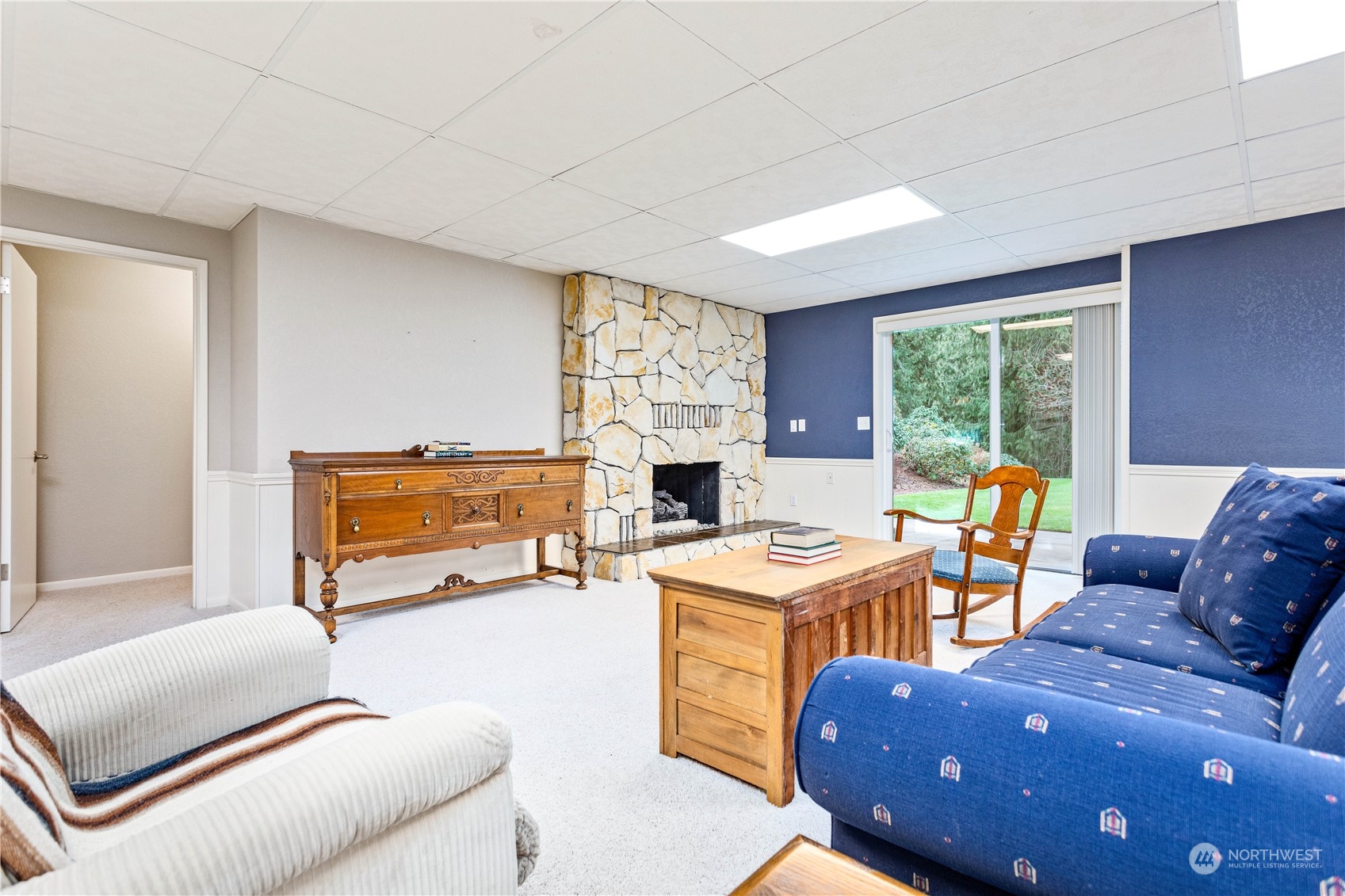 8669 Berthusen Road Lynden, WA 98264 - Photo 22 of 39 a living room with furniture a fireplace and a large window