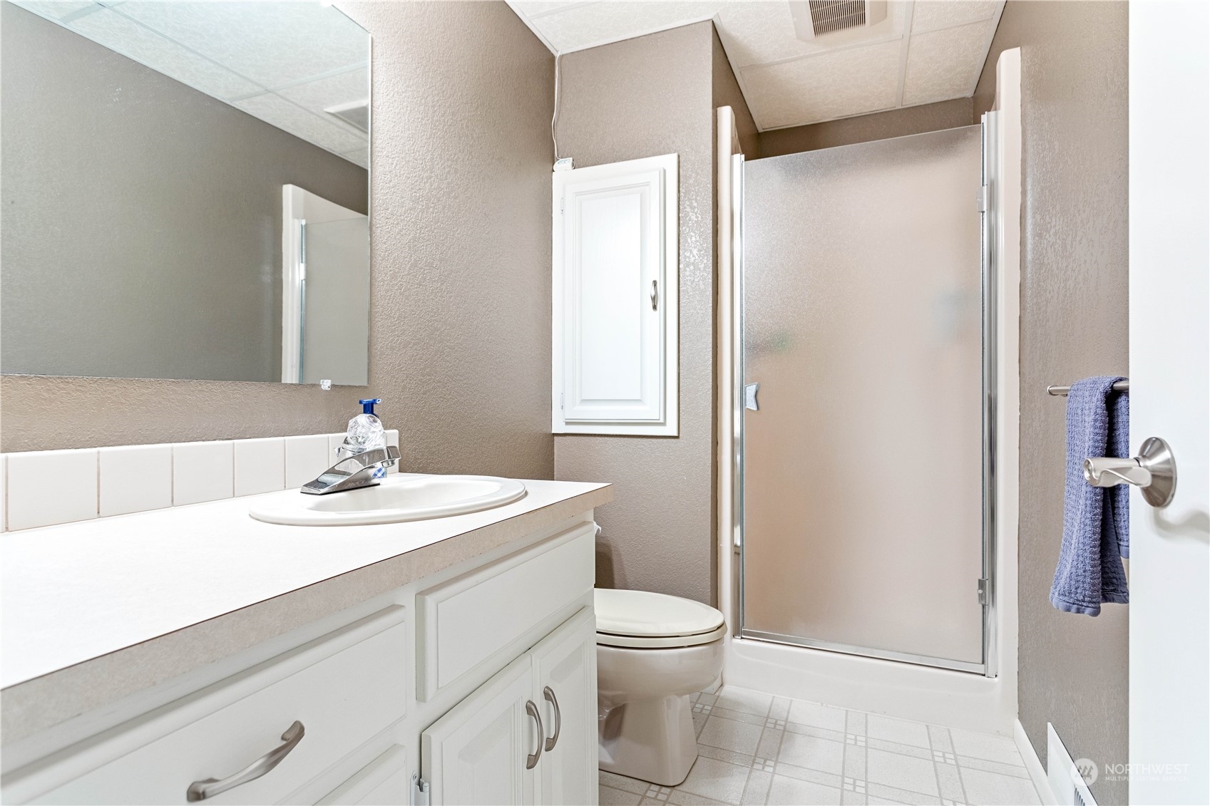 8669 Berthusen Road Lynden, WA 98264 - Photo 24 of 39 a bathroom with a sink toilet and vanity