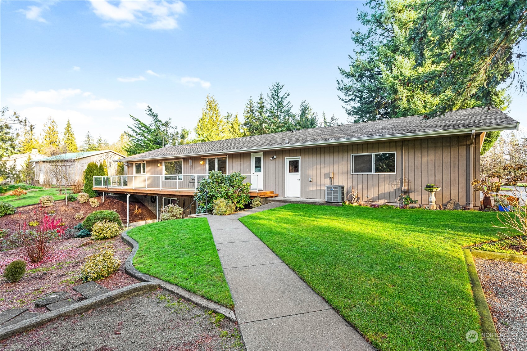 8669 Berthusen Road Lynden, WA 98264 - Photo 27 of 39 a front view of a house with garden