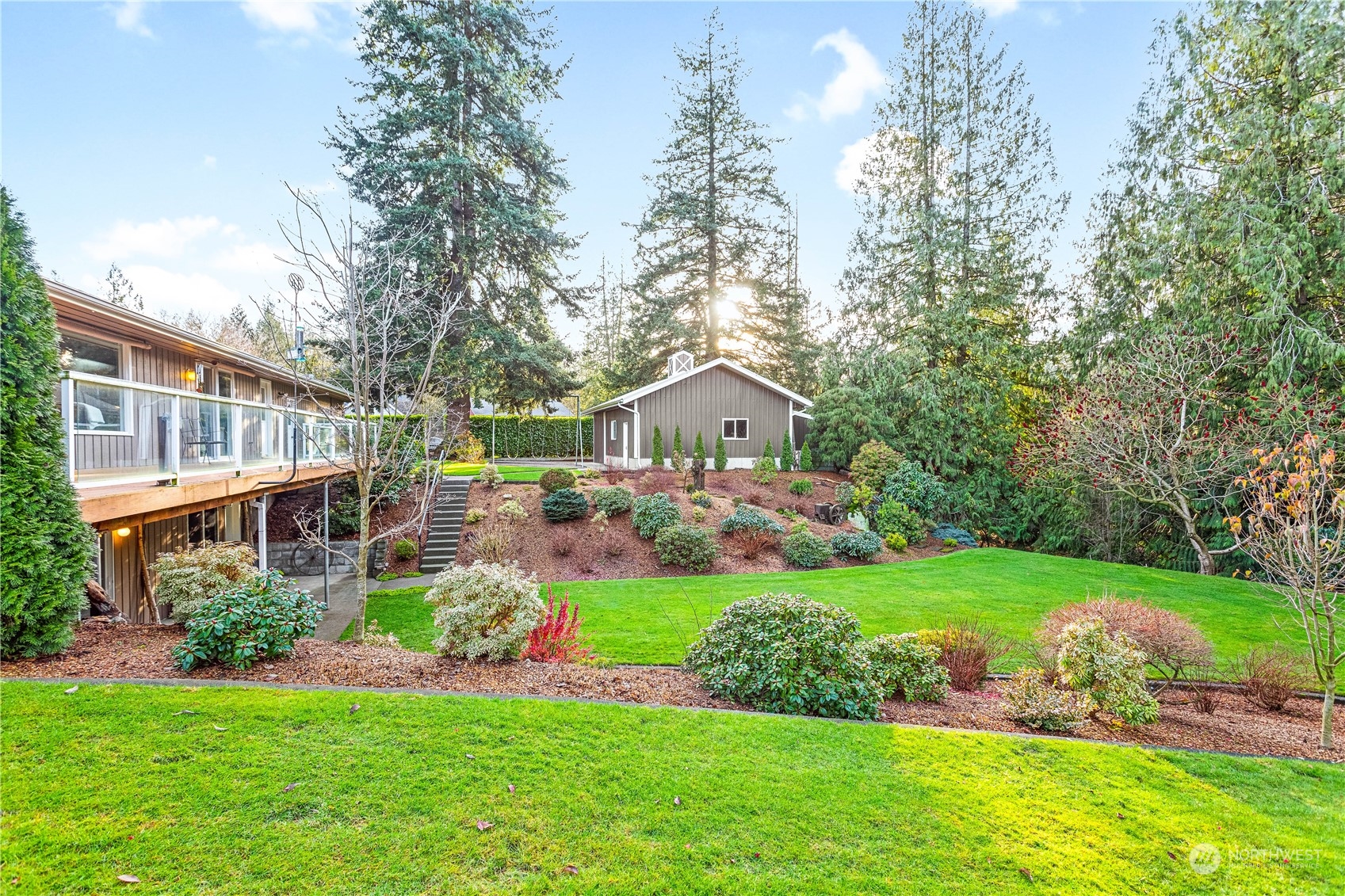 8669 Berthusen Road Lynden, WA 98264 - Photo 29 of 39 a front view of a house with a garden and trees