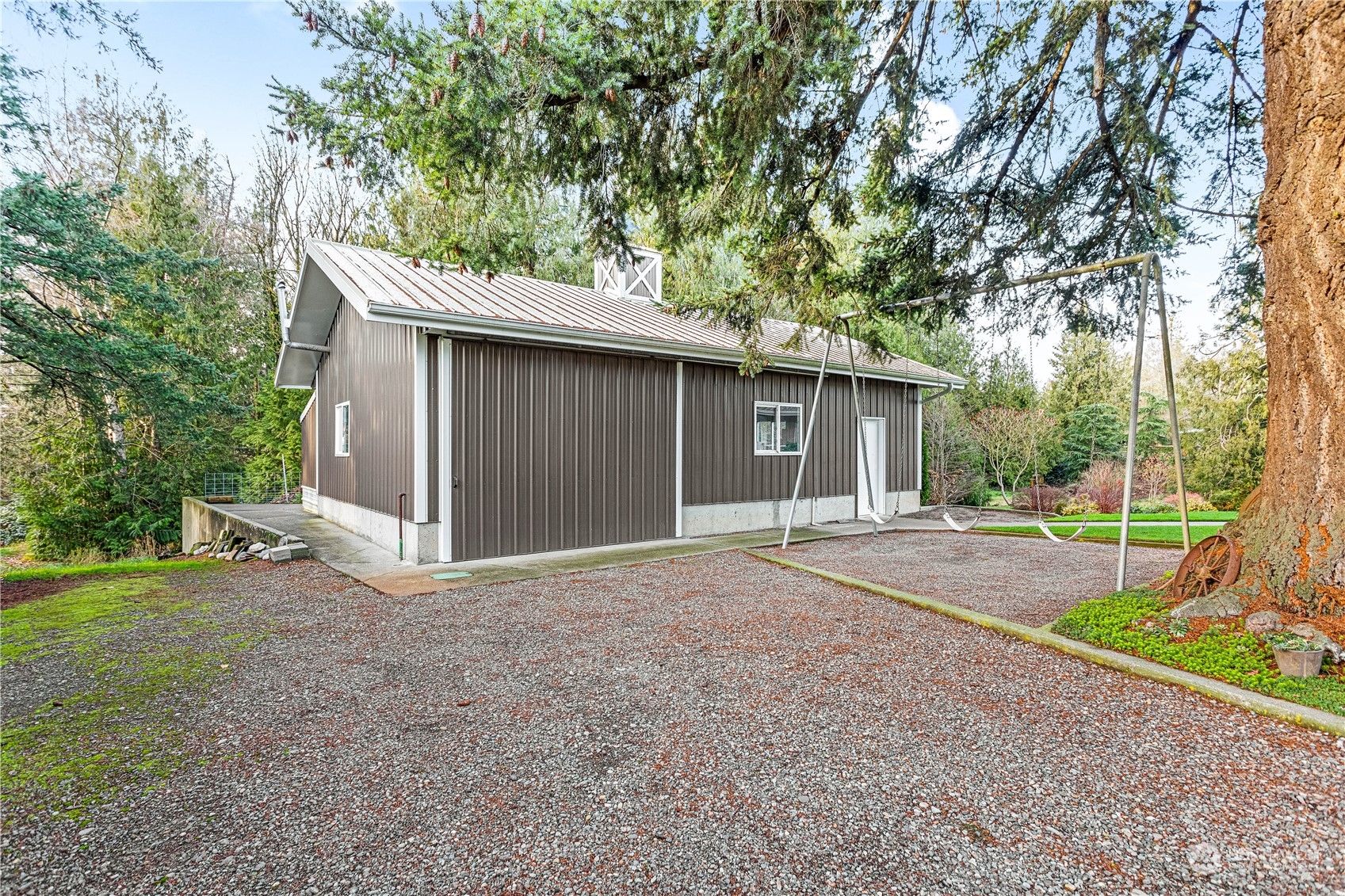 8669 Berthusen Road Lynden, WA 98264 - Photo 30 of 39 a view of a house with backyard and a garden
