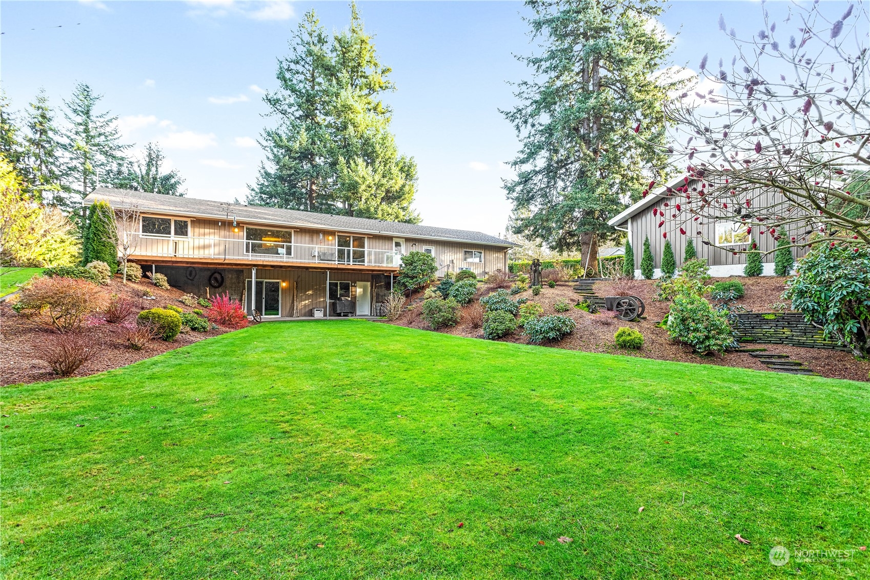 8669 Berthusen Road Lynden, WA 98264 - Photo 3 of 39 a view of a house with backyard and garden