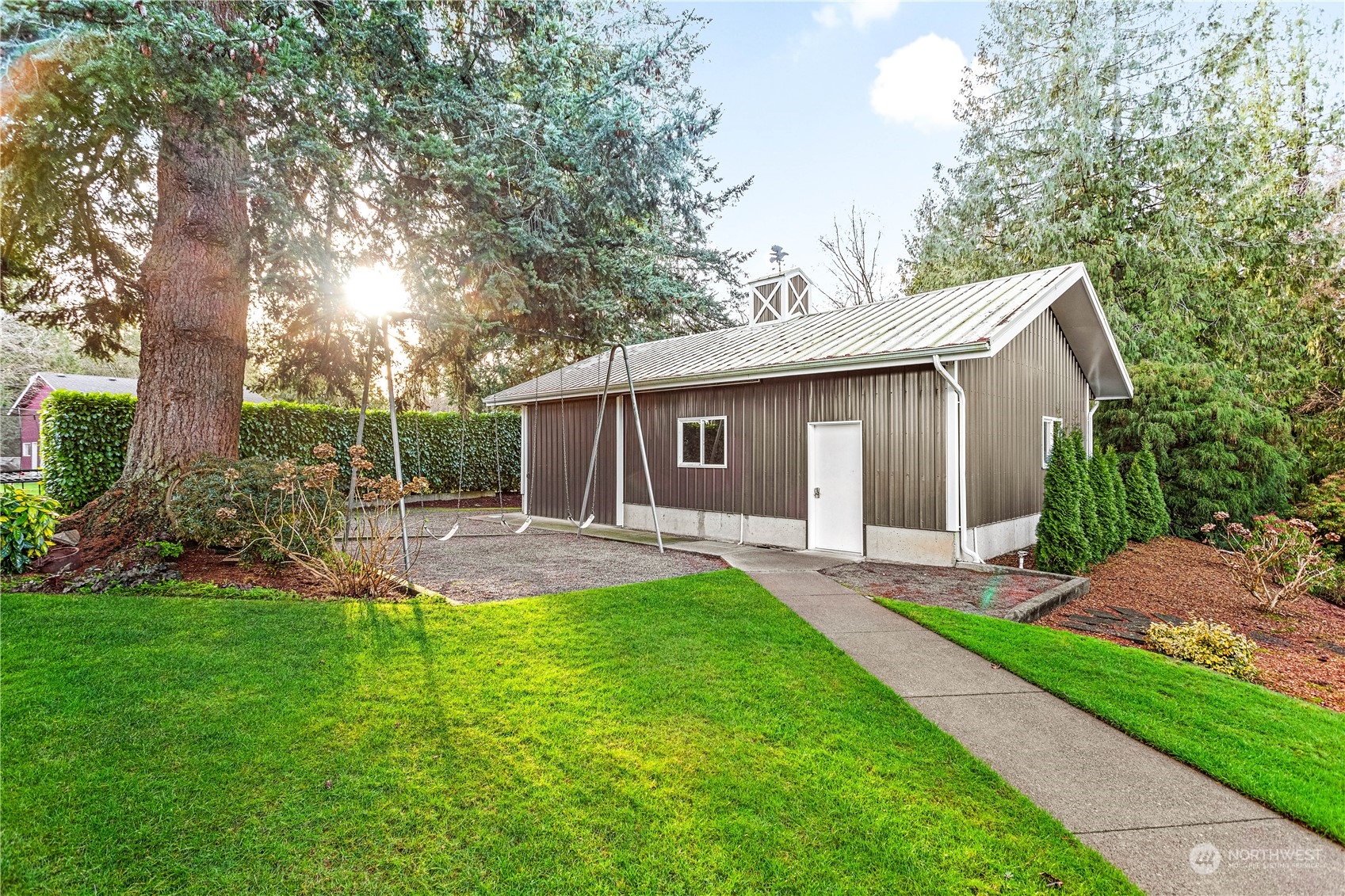 8669 Berthusen Road Lynden, WA 98264 - Photo 31 of 39 a view of a house with a yard and pathway