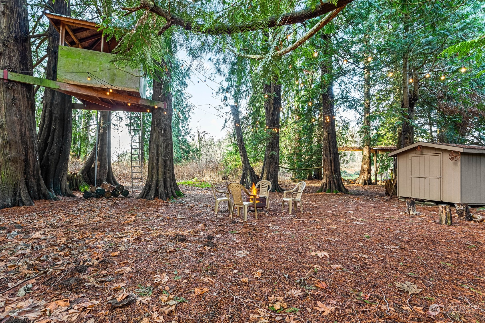 8669 Berthusen Road Lynden, WA 98264 - Photo 32 of 39 a view of a house with backyard and sitting area