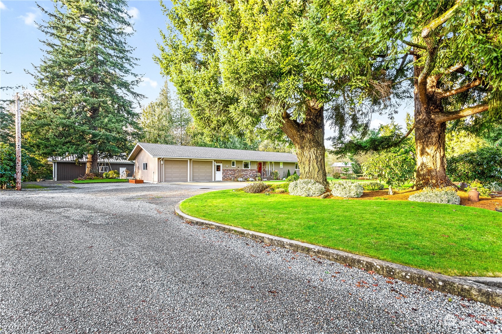 8669 Berthusen Road Lynden, WA 98264 - Photo 39 of 39 a view of a house with a yard and garage