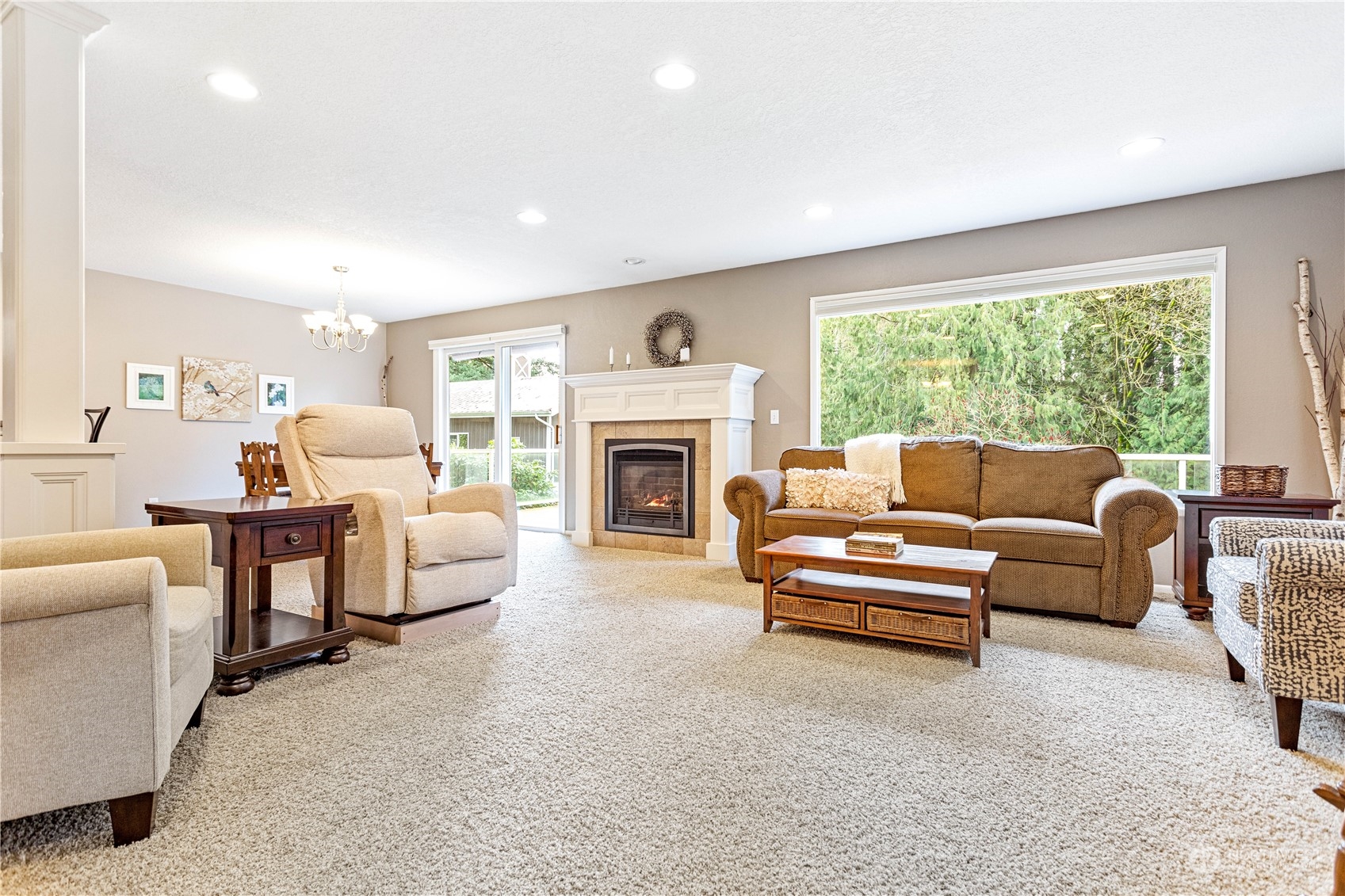 8669 Berthusen Road Lynden, WA 98264 - Photo 5 of 39 a living room with furniture and a fireplace