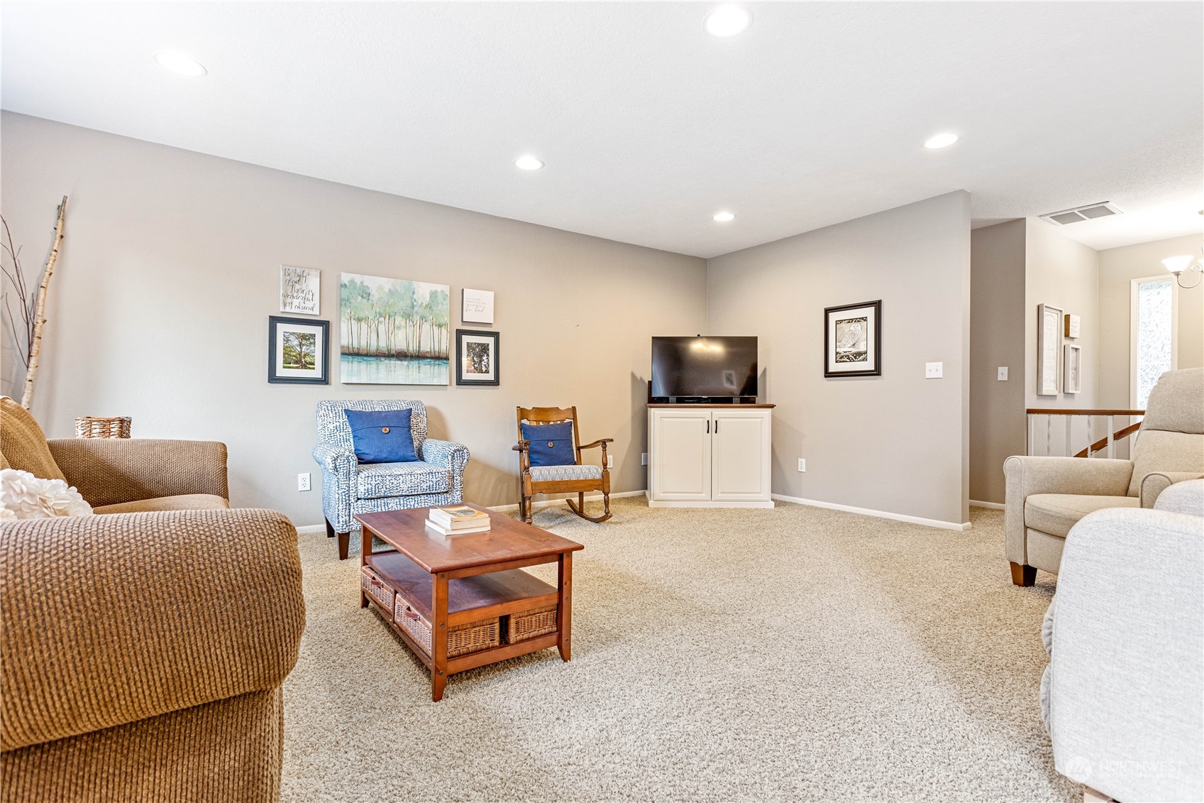 8669 Berthusen Road Lynden, WA 98264 - Photo 6 of 39 a living room with furniture and a flat screen tv