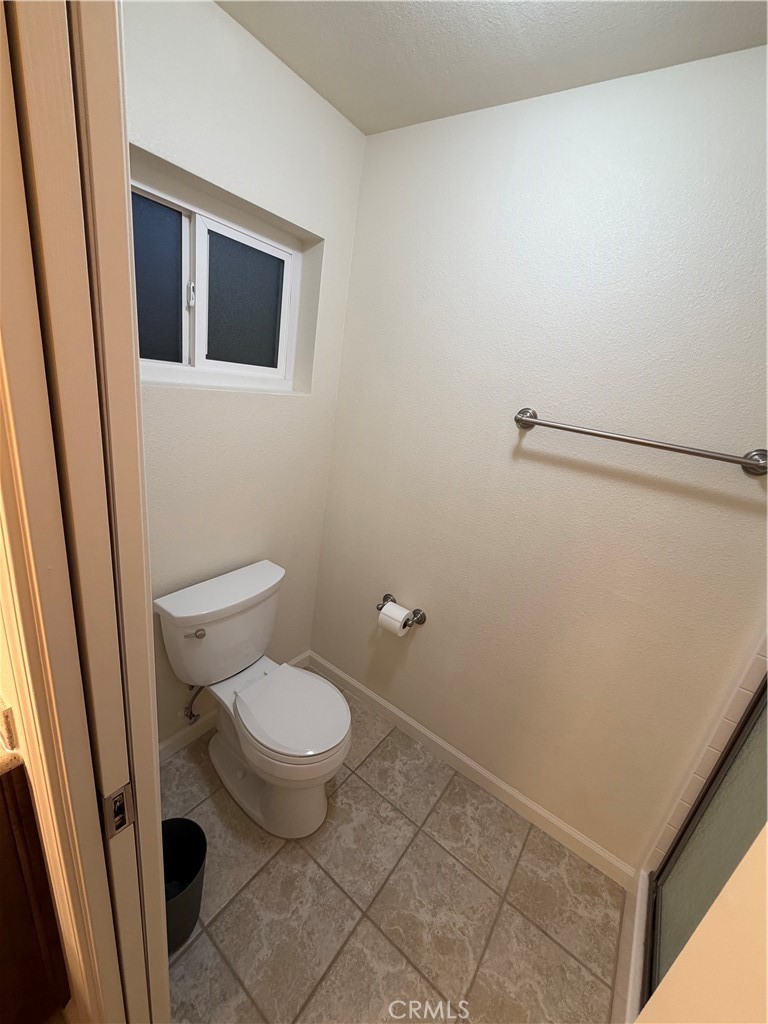 209 Kimberly Lane Ridgecrest, CA 93555 - Photo 49 of 62 a bathroom with a toilet and a sink