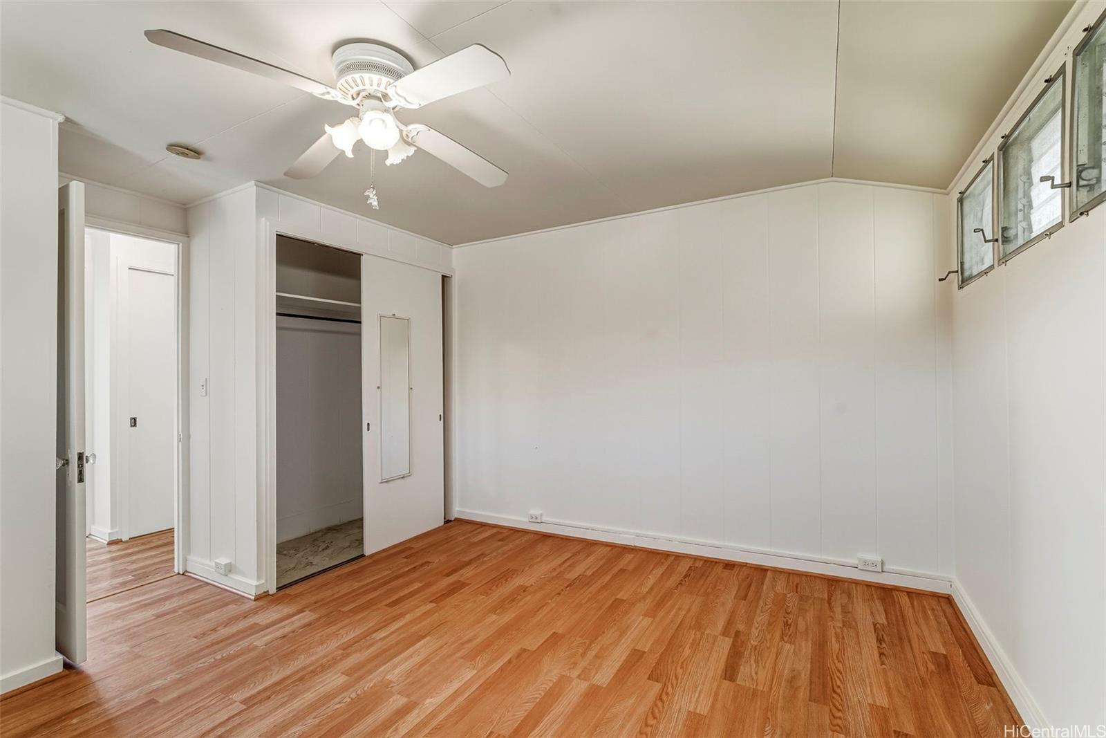 1925 St Louis Drive Honolulu, HI 96816 - Photo 16 of 25 an empty room with wooden floor and windows