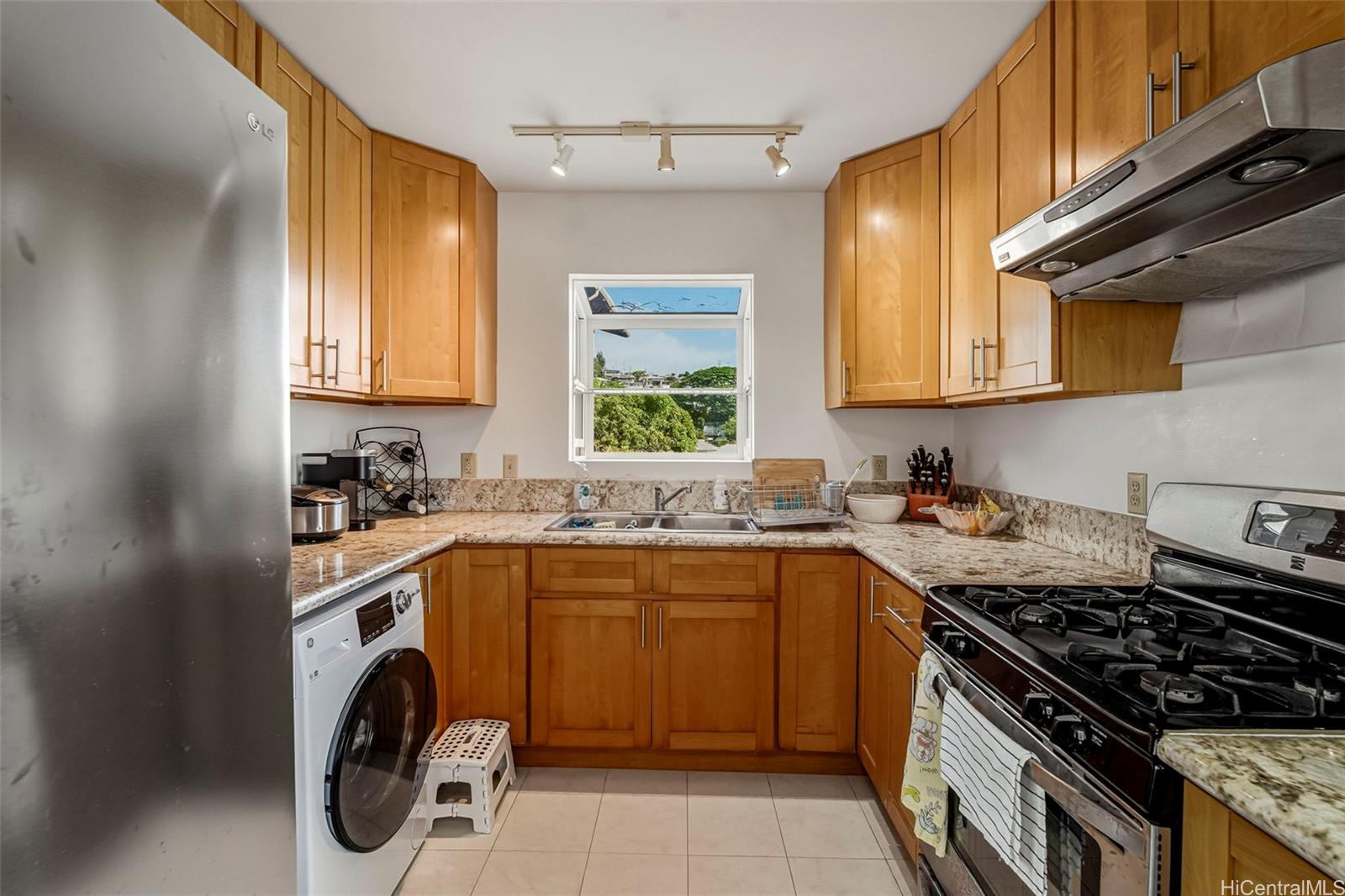 1925 St Louis Drive Honolulu, HI 96816 - Photo 9 of 25 a kitchen with a stove sink and cabinets