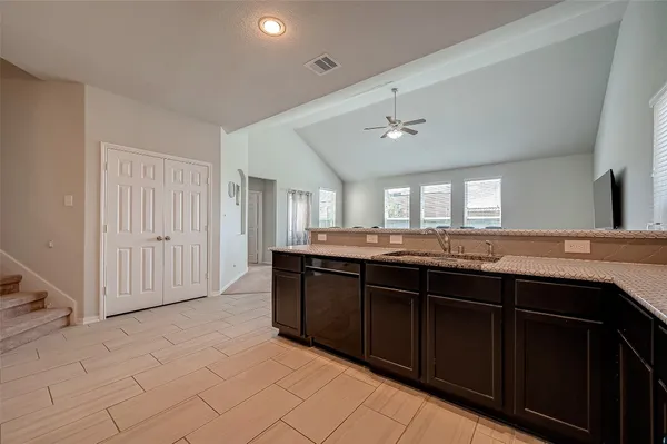 a kitchen with a sink and cabinets