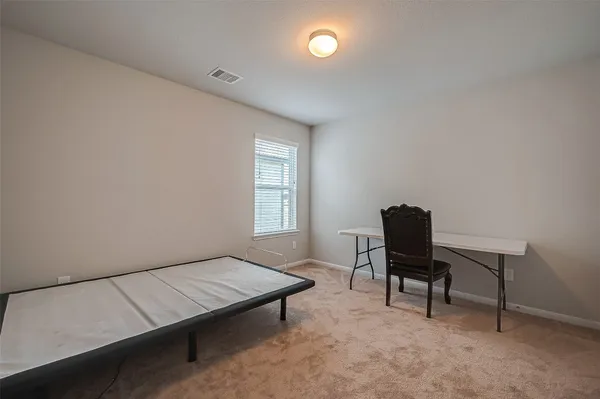 a room with a bed and a window
