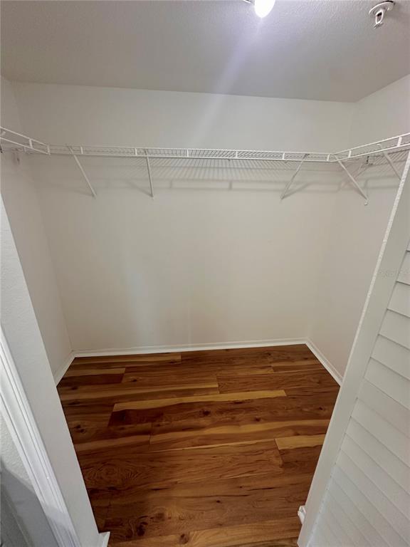 413 Summit Ridge Place, Unit 115 Longwood, FL 32779 - Photo 15 of 44 a view of a room with racks on the wall