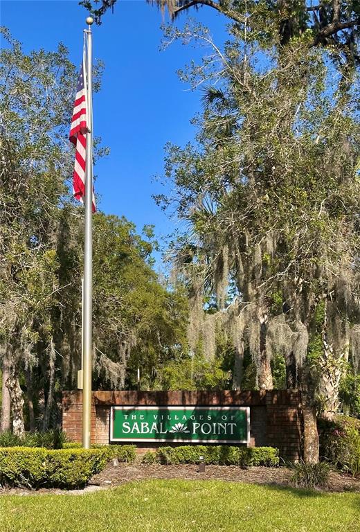 413 Summit Ridge Place, Unit 115 Longwood, FL 32779 - Photo 26 of 44 a front view of a house with a yard