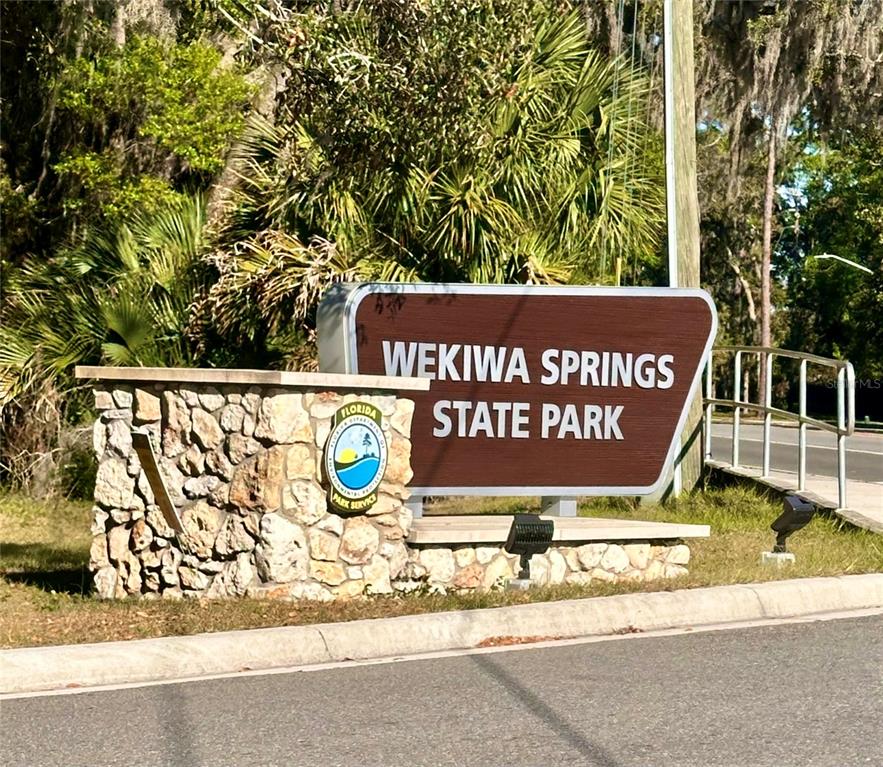 413 Summit Ridge Place, Unit 115 Longwood, FL 32779 - Photo 27 of 44 a sign on the side of a building