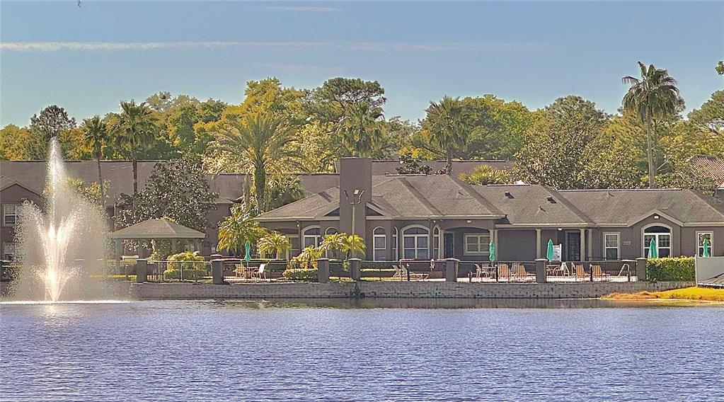 413 Summit Ridge Place, Unit 115 Longwood, FL 32779 - Photo 35 of 44 a front view of a house with swimming pool and porch with furniture