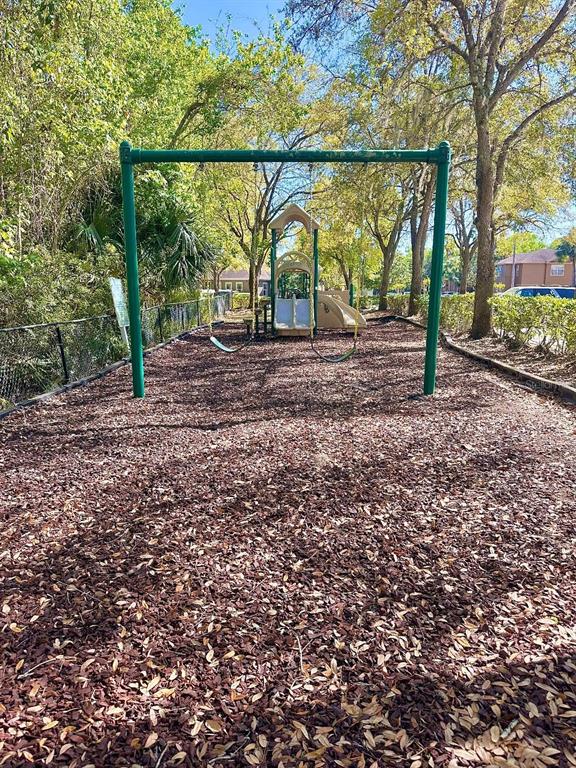413 Summit Ridge Place, Unit 115 Longwood, FL 32779 - Photo 37 of 44 a view of outdoor space with deck and tree