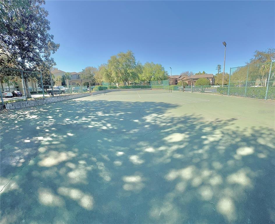 413 Summit Ridge Place, Unit 115 Longwood, FL 32779 - Photo 40 of 44 a view of a field with trees in the background