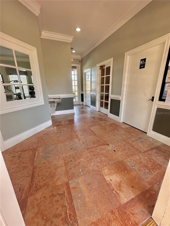 413 Summit Ridge Place, Unit 115 Longwood, FL 32779 - Photo 41 of 44 a view of an empty room with wooden floor and a window